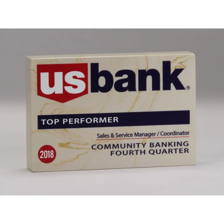 Rectangular stone paperweight with a bank logo and personalized top performer recognition for a banking employee